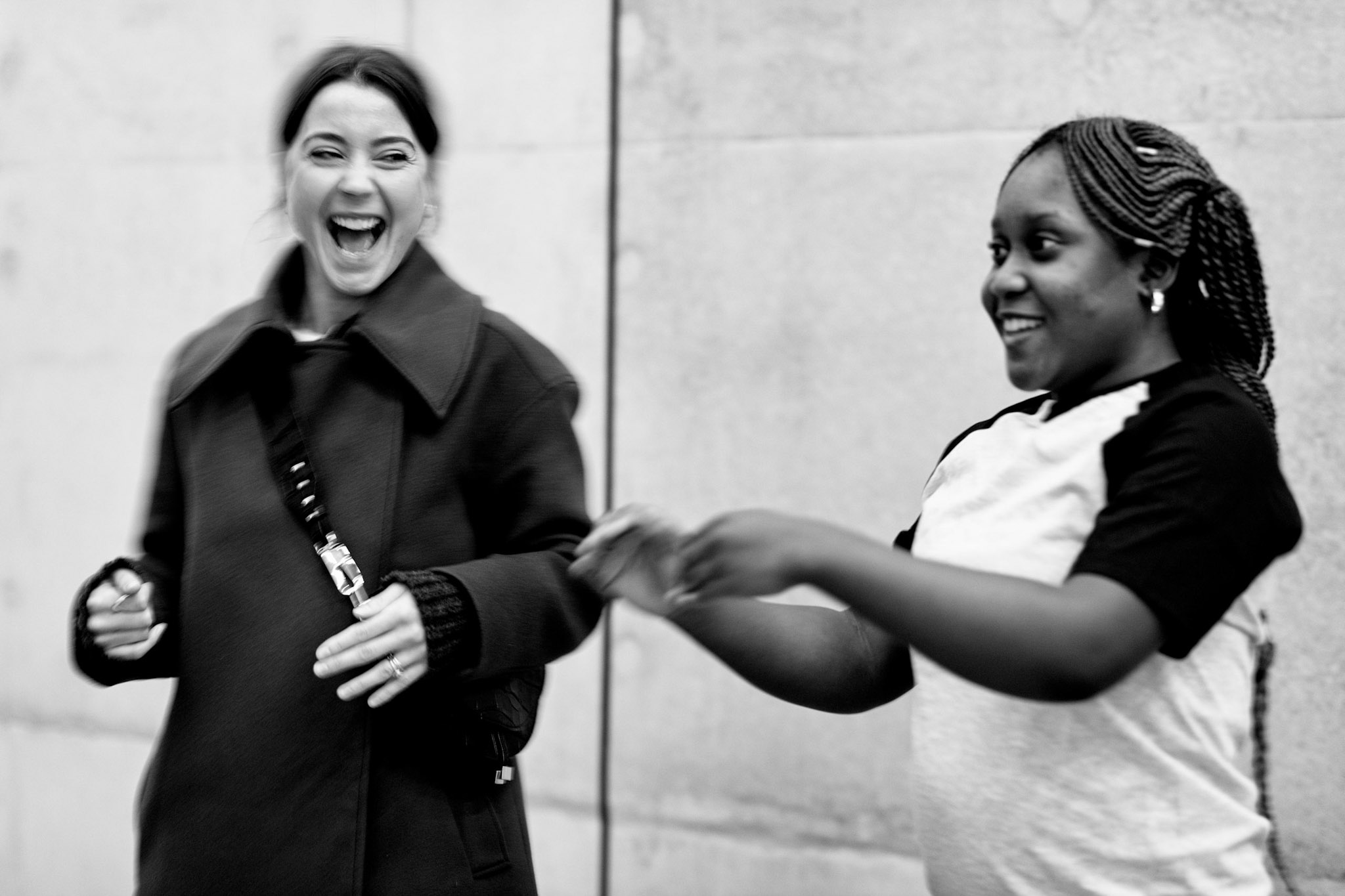 Black and white photo of Sheri working with a member of the public to learn a dance at Tate Modern